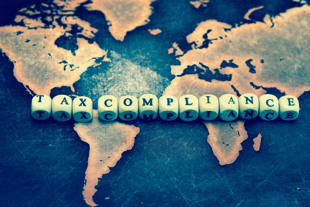 Tax,Compliance,On,Grunge,World,Map