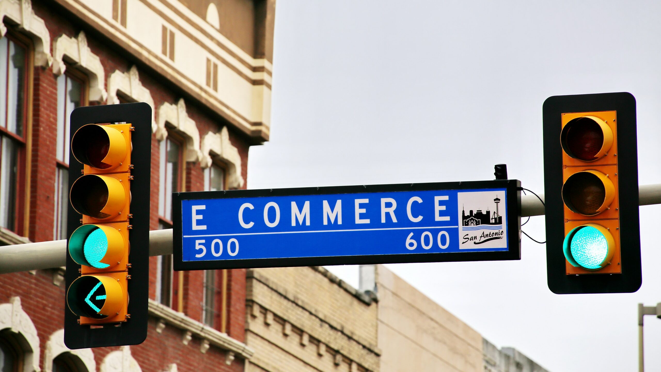 Street sign in San Antonio, Texas displaying E Commerce.